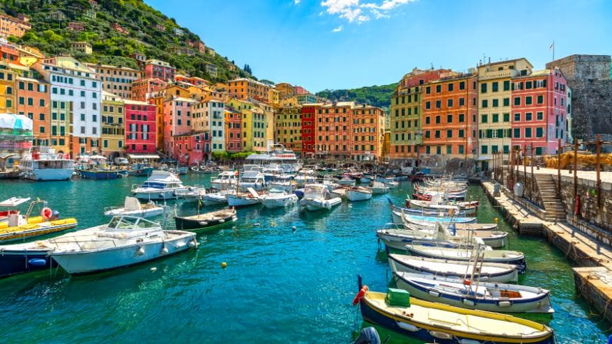 Boats moored at the colourful waterfront in Camogli