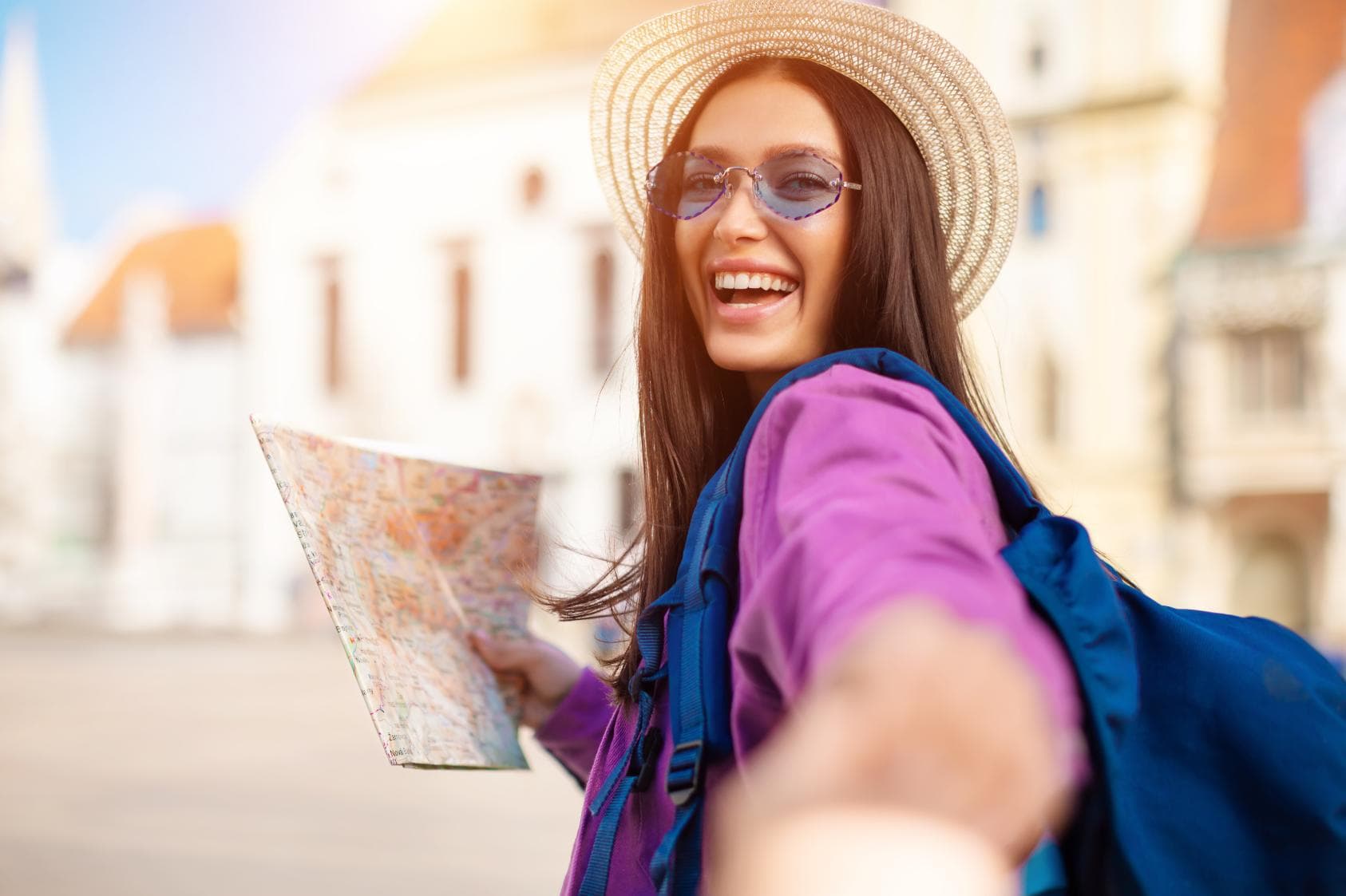 A traveller with a map exploring a new destination